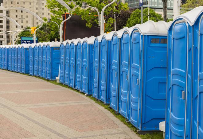 a line of portable restrooms at a sporting event, providing athletes and spectators with clean and accessible facilities in Bushnell, FL